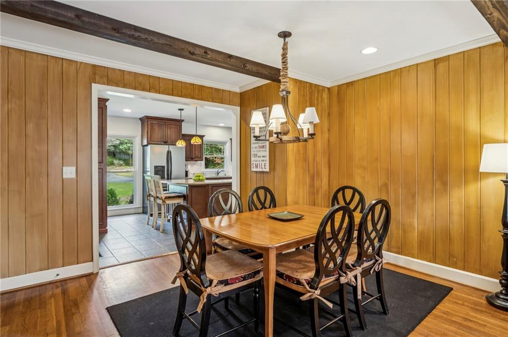 3384 Pine Meadow Road Northwest Atlanta, GA 30327 - Photo 17 of 56 a view of a dining room with furniture window and wooden floor