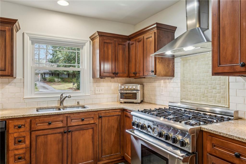3384 Pine Meadow Road Northwest Atlanta, GA 30327 - Photo 22 of 56 a kitchen with sink a stove and a microwave