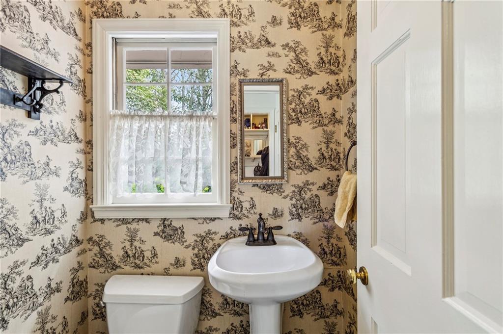 3384 Pine Meadow Road Northwest Atlanta, GA 30327 - Photo 24 of 56 a bathroom with a sink toilet and mirror