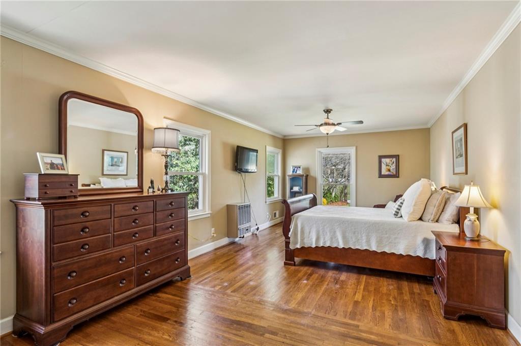 3384 Pine Meadow Road Northwest Atlanta, GA 30327 - Photo 28 of 56 a spacious bedroom with a bed and a dresser