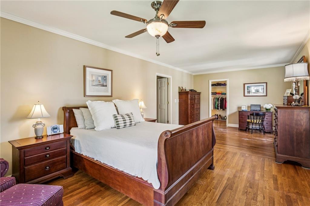 3384 Pine Meadow Road Northwest Atlanta, GA 30327 - Photo 29 of 56 a bedroom with a bed and a chandelier