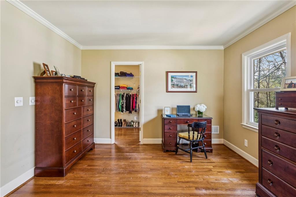 3384 Pine Meadow Road Northwest Atlanta, GA 30327 - Photo 30 of 56 a view of a workspace with furniture and a window