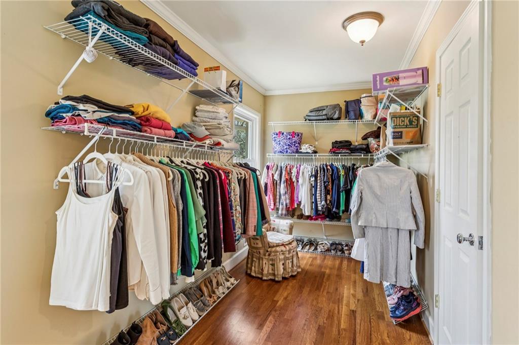 3384 Pine Meadow Road Northwest Atlanta, GA 30327 - Photo 31 of 56 a view of walk in closet with clothes and shoes