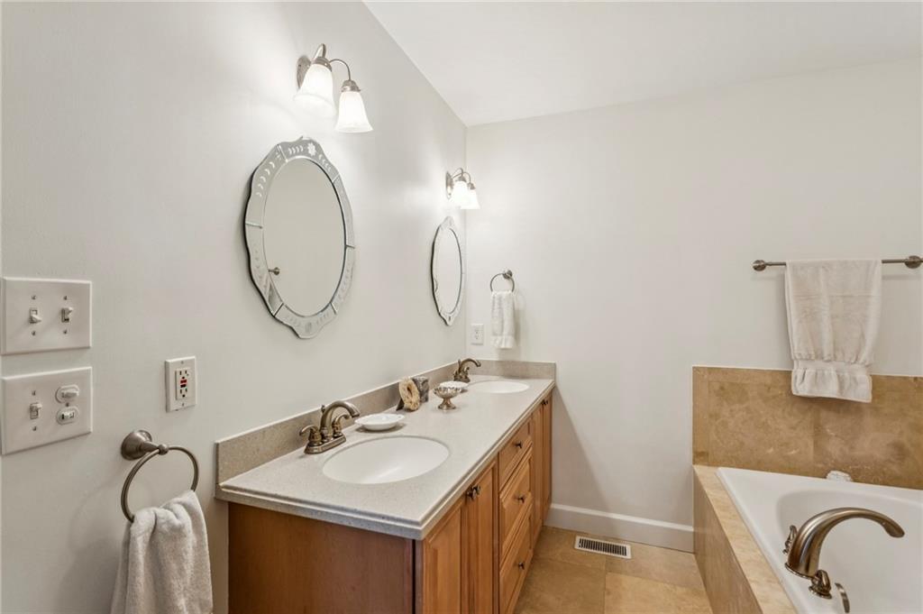 3384 Pine Meadow Road Northwest Atlanta, GA 30327 - Photo 32 of 56 a bathroom with a sink and a mirror