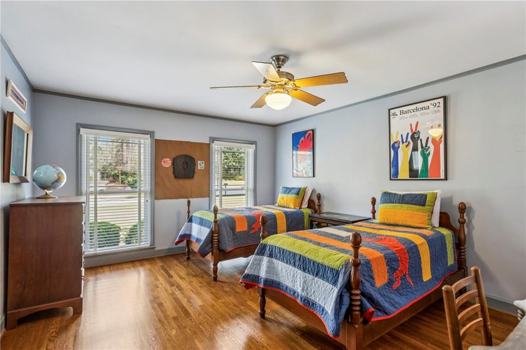 3384 Pine Meadow Road Northwest Atlanta, GA 30327 - Photo 34 of 56 a bedroom with two beds and a chandelier