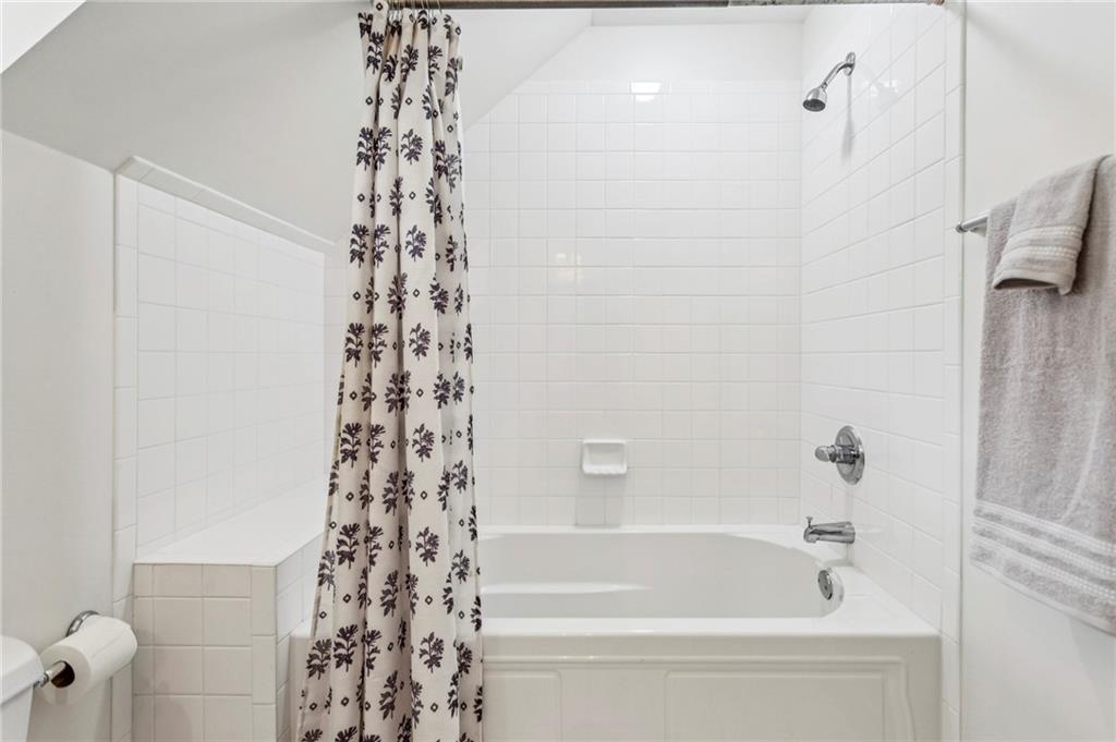 3384 Pine Meadow Road Northwest Atlanta, GA 30327 - Photo 40 of 56 a bathroom with a bathtub and shower