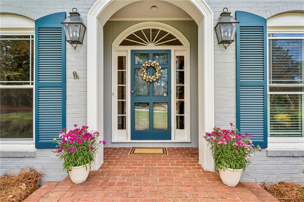 3384 Pine Meadow Road Northwest Atlanta, GA 30327 - Photo 4 of 56 a front view of a house with an outdoor space