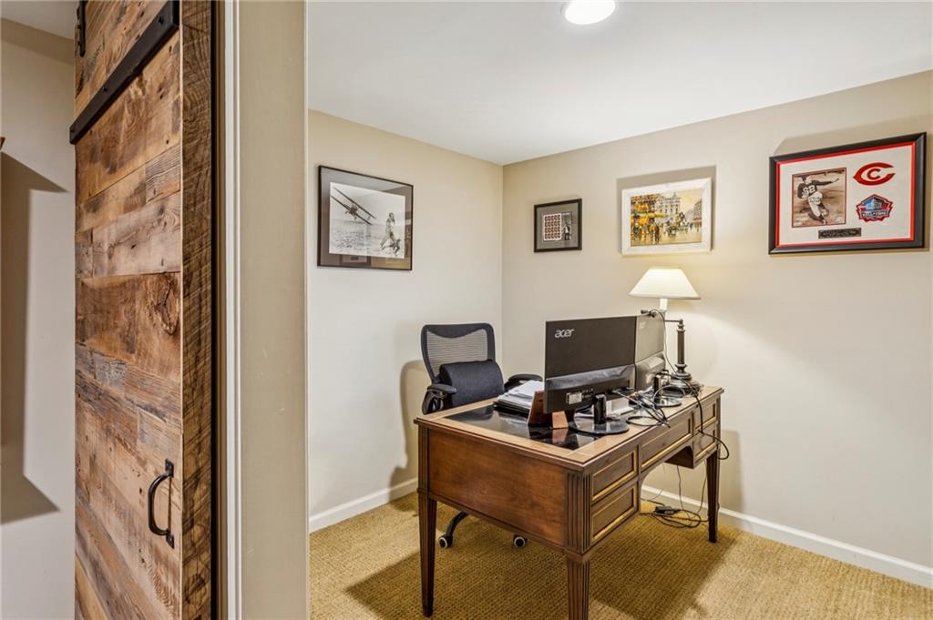 3384 Pine Meadow Road Northwest Atlanta, GA 30327 - Photo 45 of 56 a view of a workspace with furniture and a window