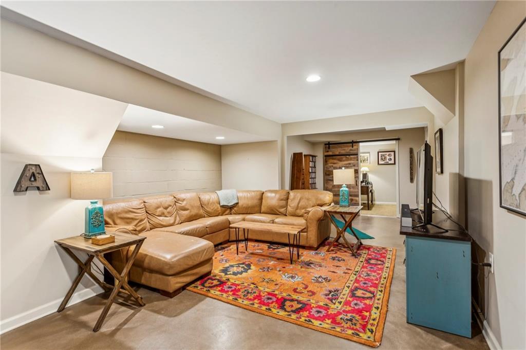 3384 Pine Meadow Road Northwest Atlanta, GA 30327 - Photo 46 of 56 a living room with furniture a rug and a window