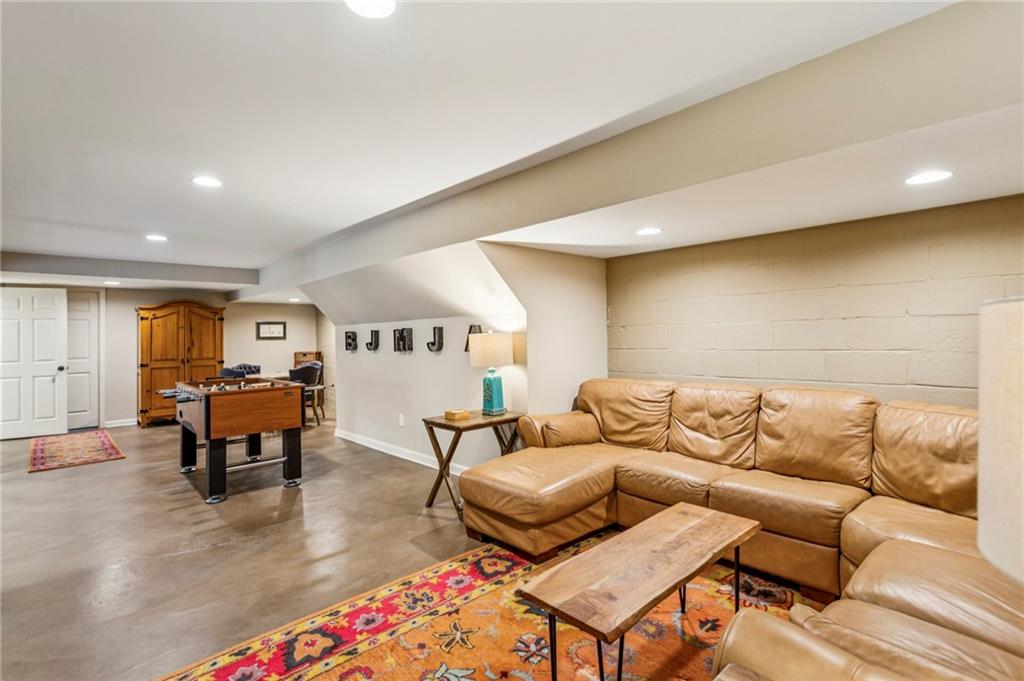 3384 Pine Meadow Road Northwest Atlanta, GA 30327 - Photo 47 of 56 a living room with furniture and wooden floor