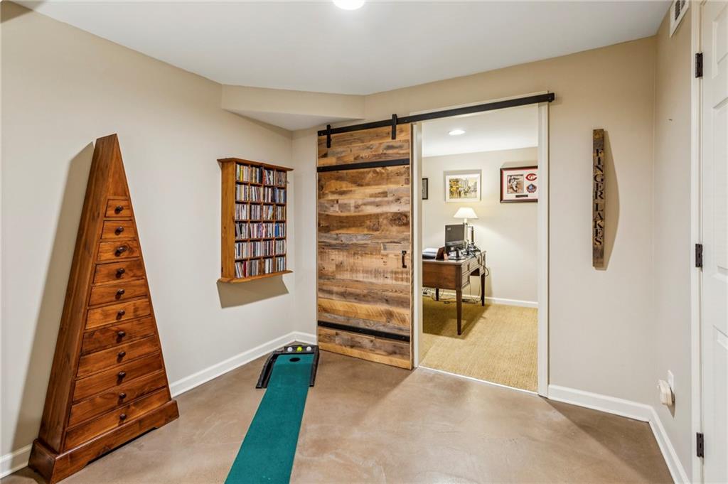 3384 Pine Meadow Road Northwest Atlanta, GA 30327 - Photo 48 of 56 a view of a bedroom with furniture and closet