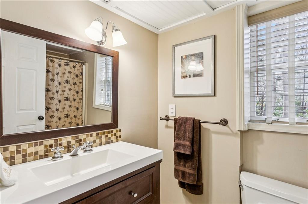 3384 Pine Meadow Road Northwest Atlanta, GA 30327 - Photo 49 of 56 a bathroom with a sink vanity and a mirror