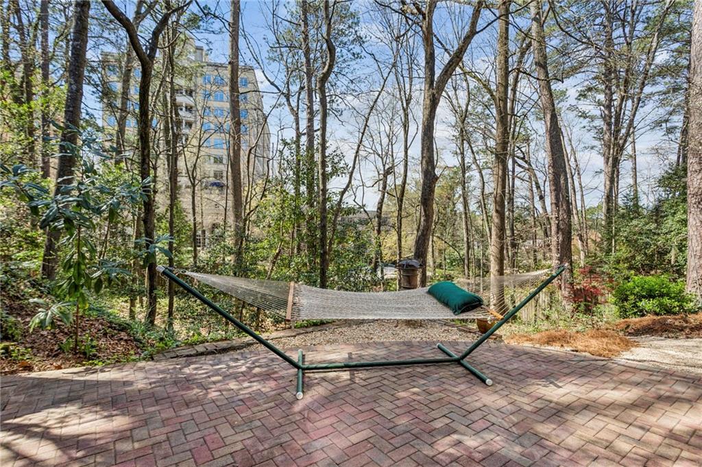 3384 Pine Meadow Road Northwest Atlanta, GA 30327 - Photo 52 of 56 a wooden bench sitting in the middle of a yard