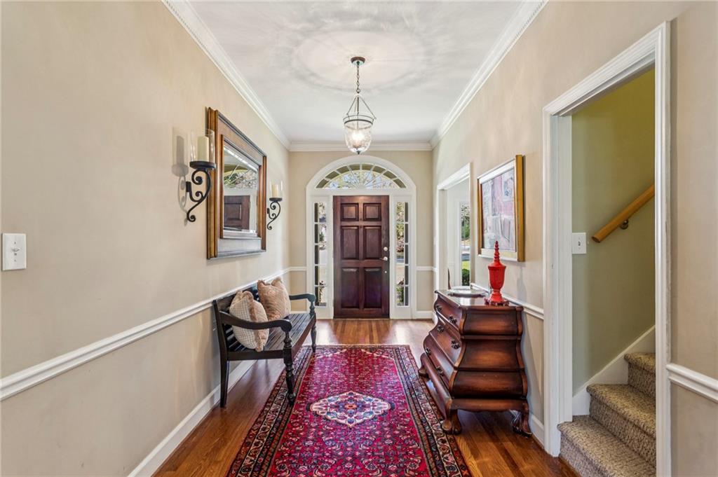3384 Pine Meadow Road Northwest Atlanta, GA 30327 - Photo 6 of 56 a living room with furniture and a chandelier