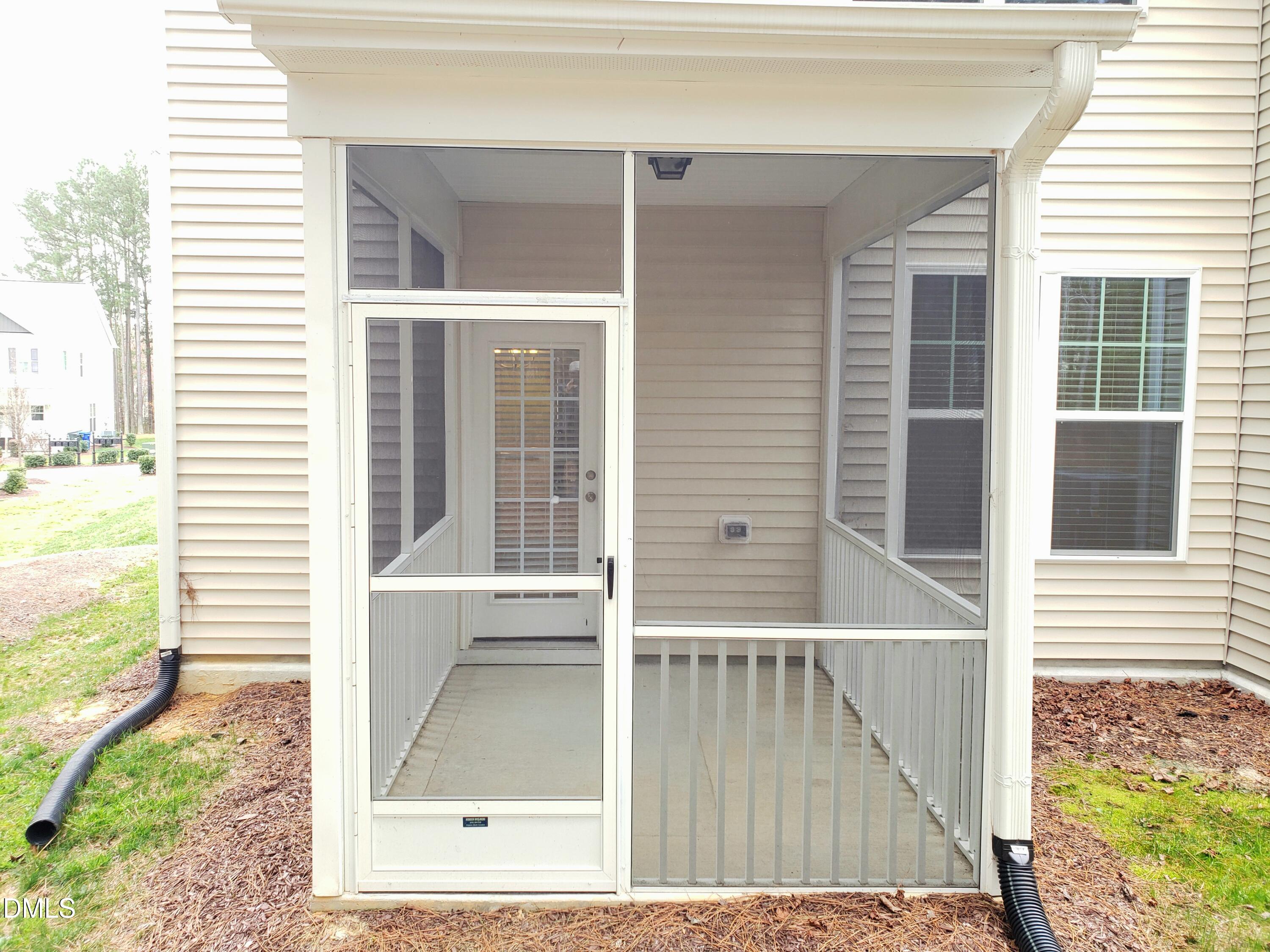 16 Grifton Place Durham, NC 27704 - Photo 8 of 16 a view of a balcony with a floor to ceiling window and wooden floor