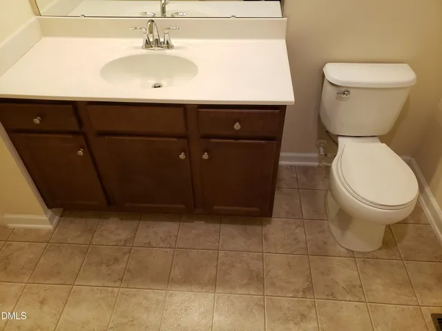 a bathroom with a toilet and a sink