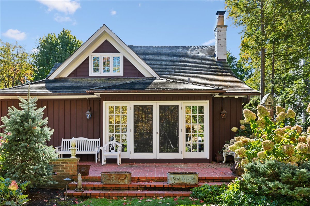 345 Sylvan Road Lake Bluff, IL 60044 - Photo 16 of 55 a front view of a house with a garden