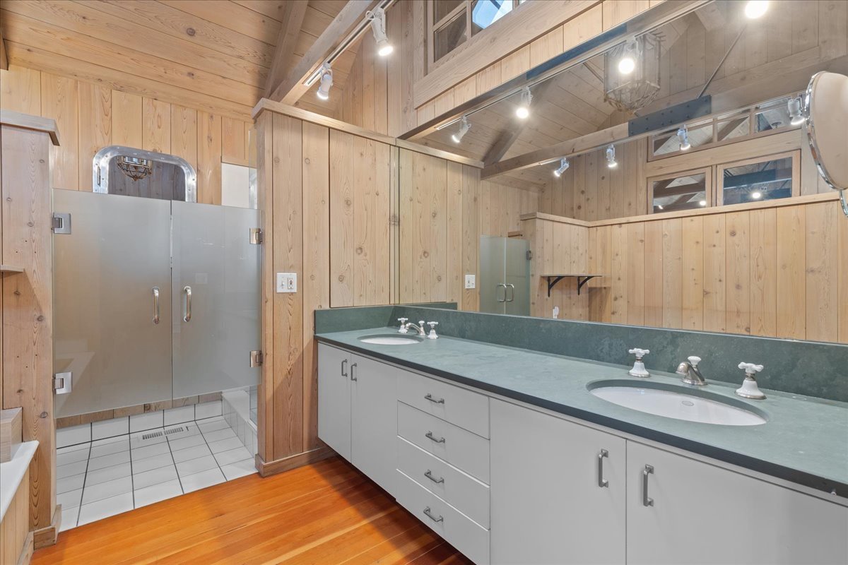 345 Sylvan Road Lake Bluff, IL 60044 - Photo 36 of 55 a bathroom with a granite countertop sink a mirror and a shower