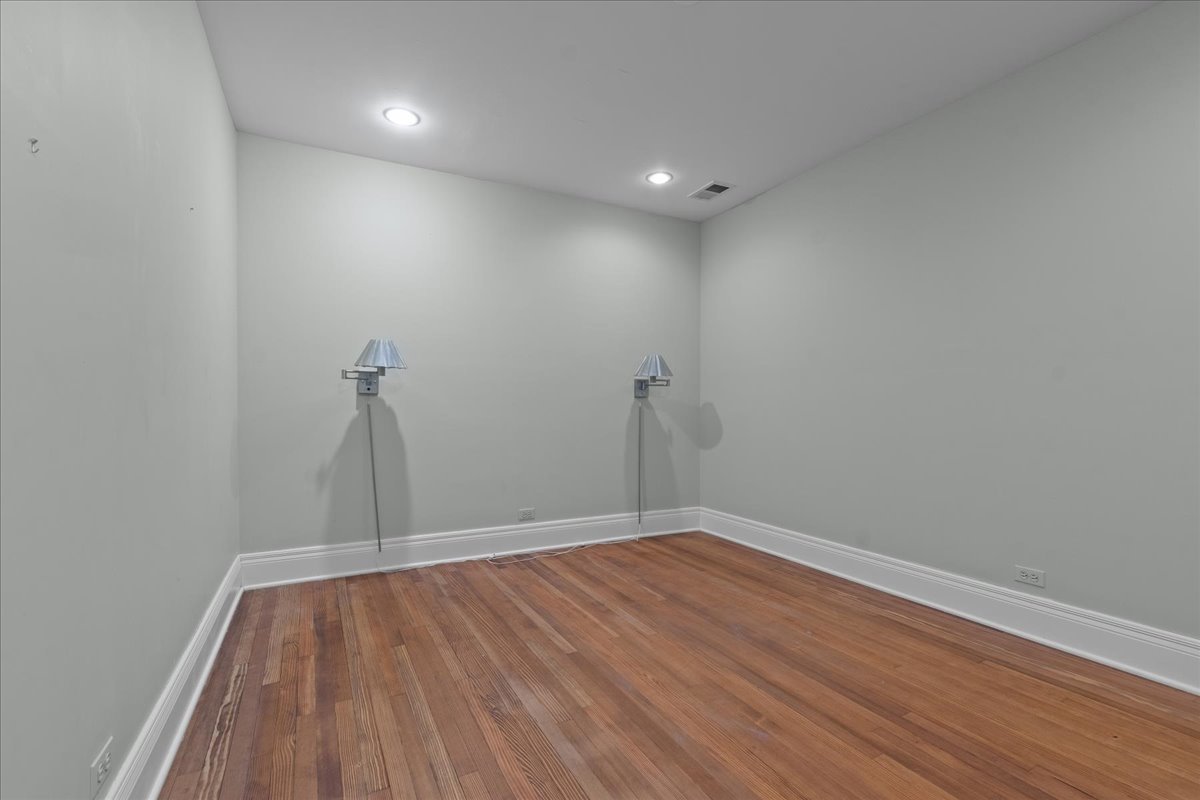 345 Sylvan Road Lake Bluff, IL 60044 - Photo 54 of 55 a view of room with window and wooden floor