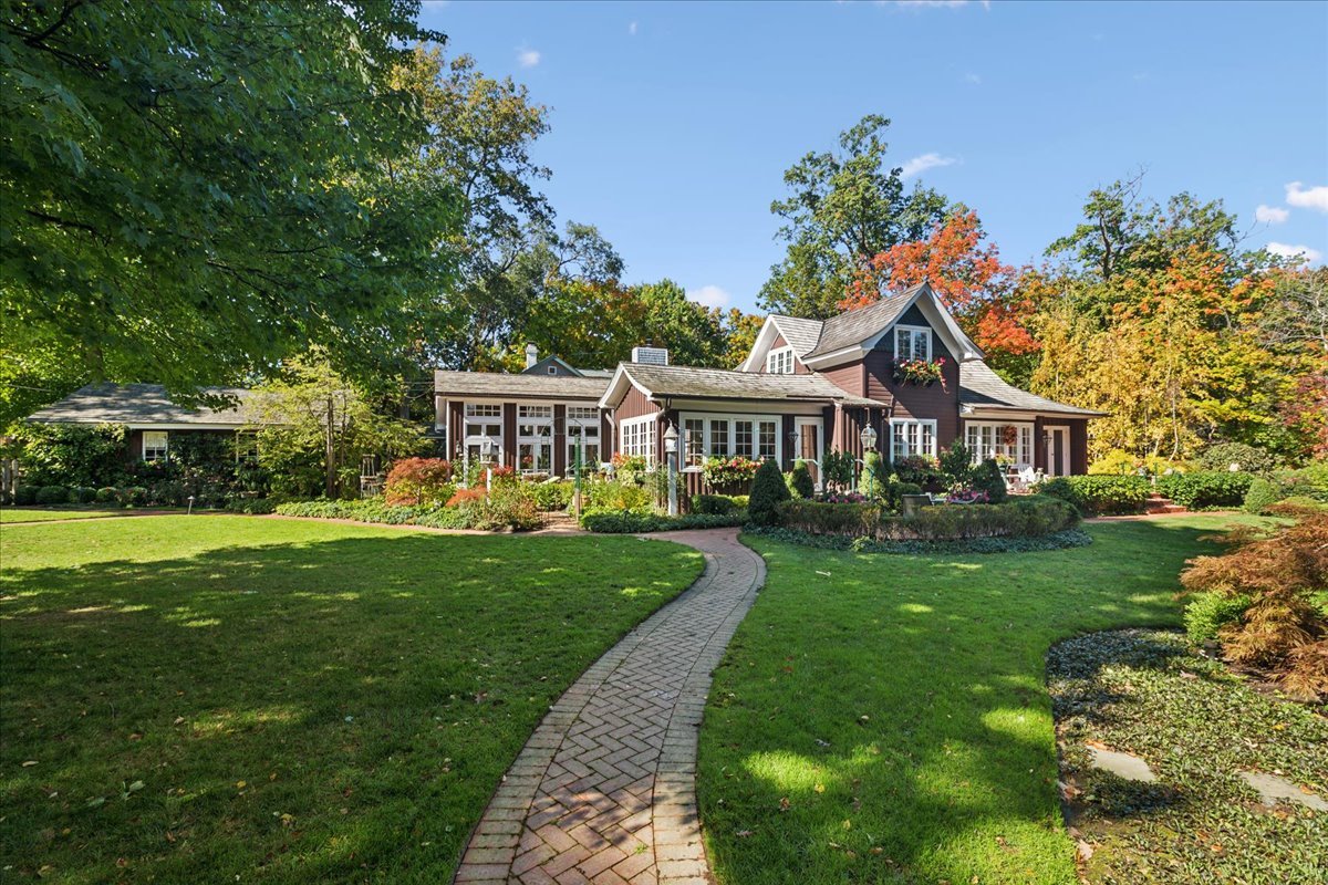 345 Sylvan Road Lake Bluff, IL 60044 - Photo 8 of 55 a front view of a house with garden and porch