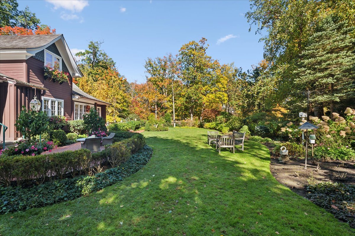 345 Sylvan Road Lake Bluff, IL 60044 - Photo 9 of 55 a view of backyard with a huge green area and wooden fence