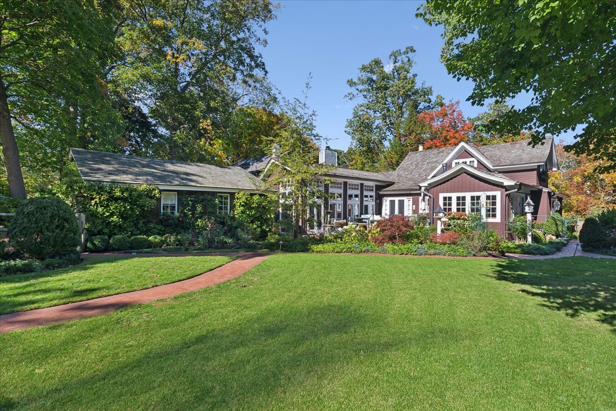 345 Sylvan Road Lake Bluff, IL 60044 - Photo 10 of 55 a front view of a house with garden