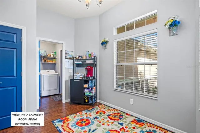 a view of an entryway with wooden floor