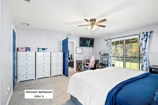 a bed room with a bed and a large window