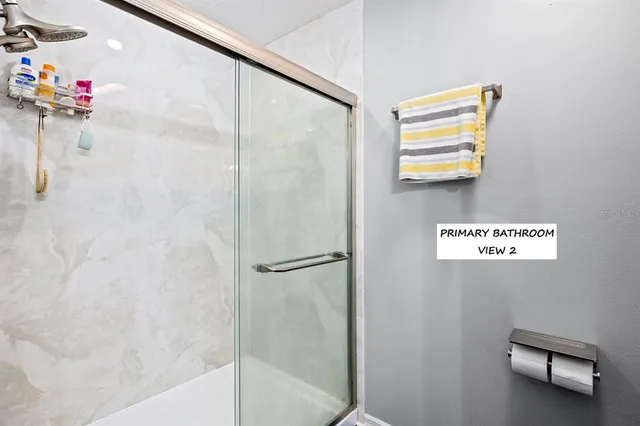 a bathroom with a shower and a sink