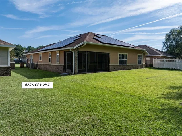a view of open pool with trees in the background