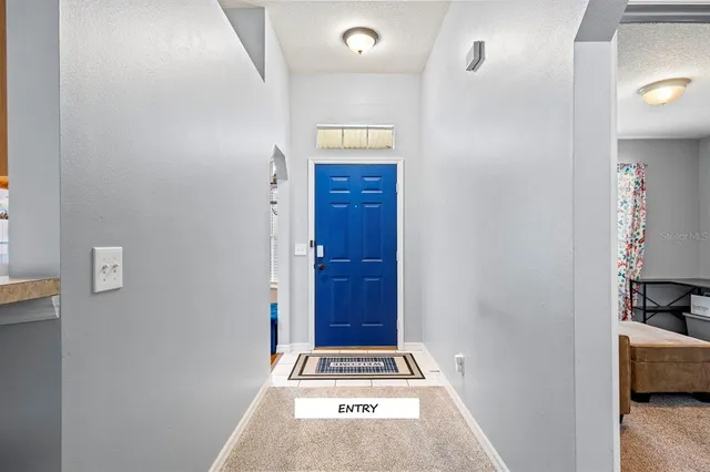 a view of front door with wooden floor