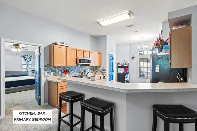 a kitchen with a table and chairs in it