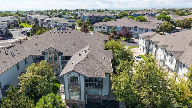 an aerial view of a house with a garden