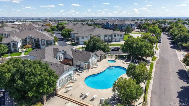 an aerial view of a house with yard swimming pool and outdoor seating
