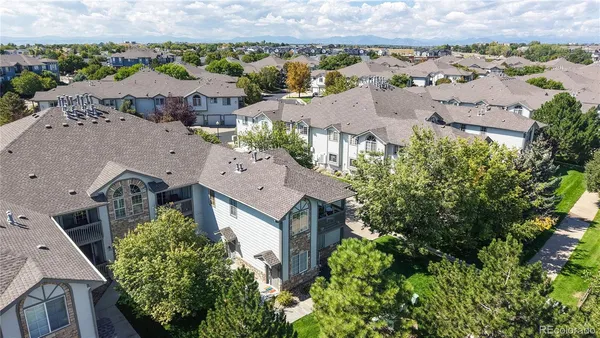an aerial view of a house with a garden