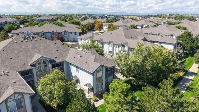 an aerial view of a house with a garden