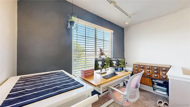 a dining room with a table and chairs