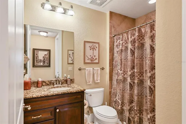 a view of a livingroom with workspace and a couch