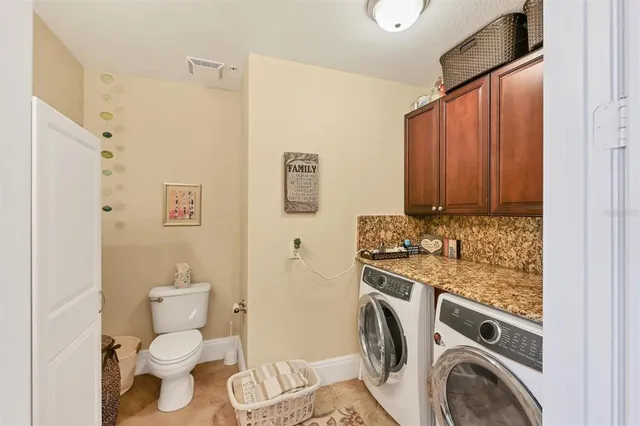 a balcony with furniture and a potted plant