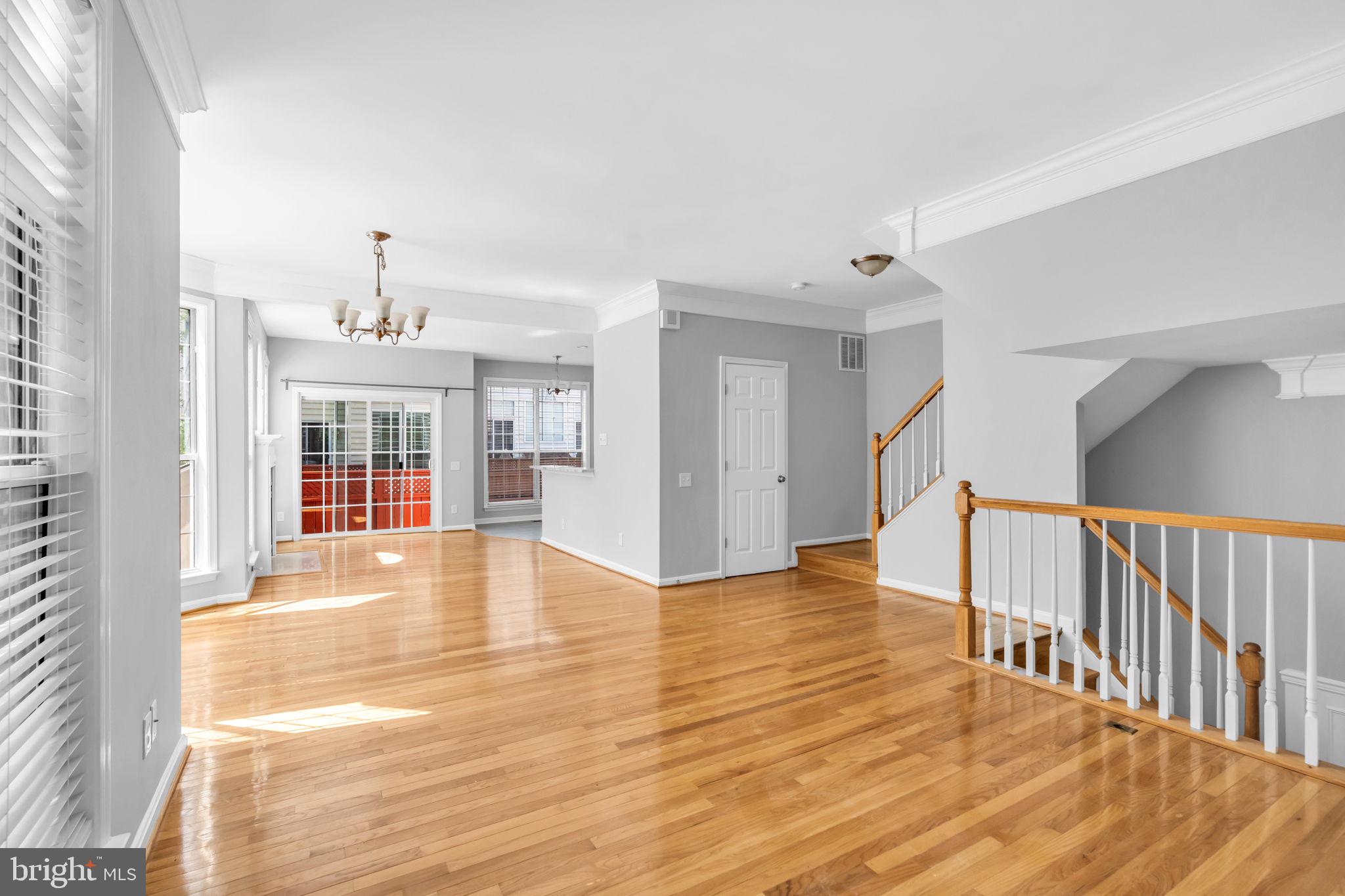 6013 Riddle Walk Alexandria, VA 22312 - Photo 6 of 31 a view of an empty room with wooden floor and a window