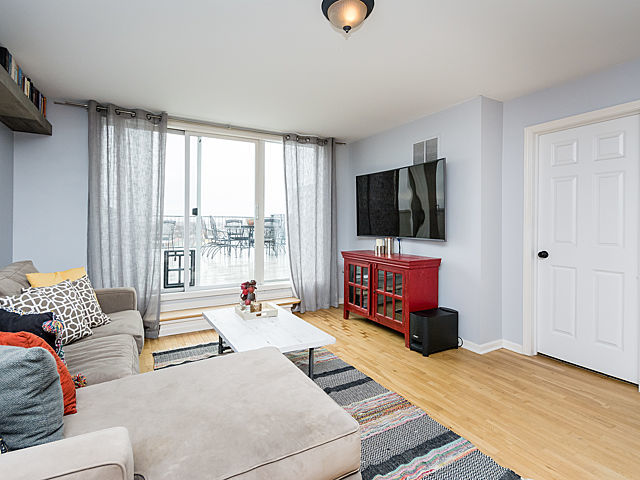2127 West Rice Street, Unit 4E Chicago, IL 60622 - Photo 20 of 23 a living room with furniture and a flat screen tv