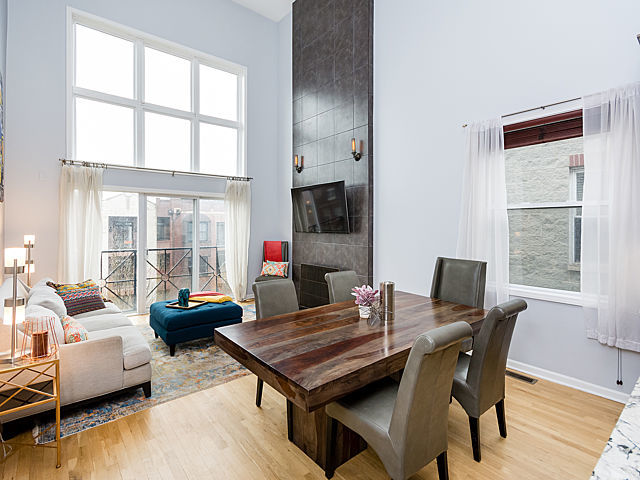 2127 West Rice Street, Unit 4E Chicago, IL 60622 - Photo 3 of 23 a view of a dining room with furniture window and wooden floor