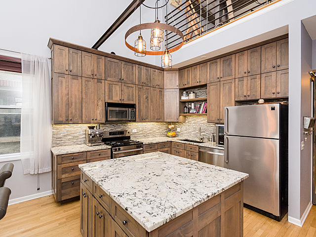 2127 West Rice Street, Unit 4E Chicago, IL 60622 - Photo 9 of 23 a kitchen with a refrigerator a stove a sink and a refrigerator