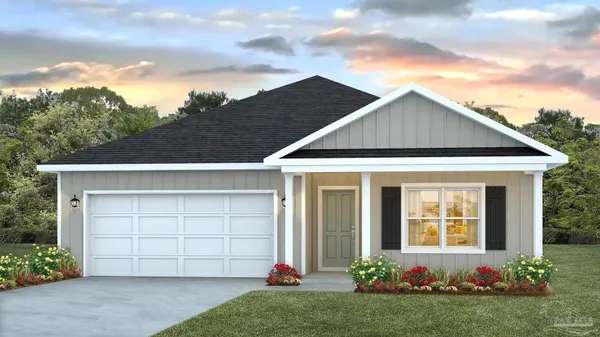 a front view of a house with a garden and garage