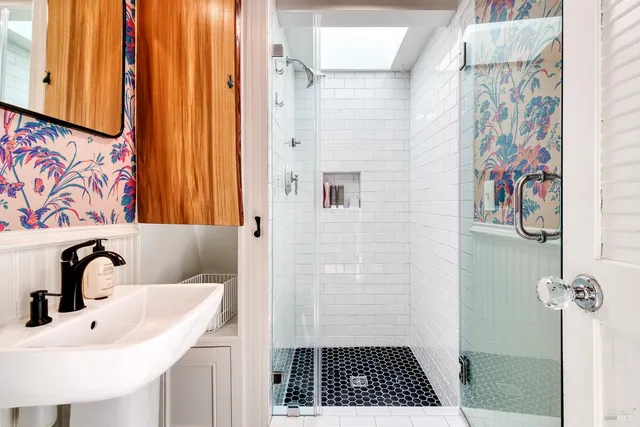 a bathroom with a sink and a mirror