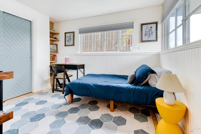 a living room with furniture and a rug