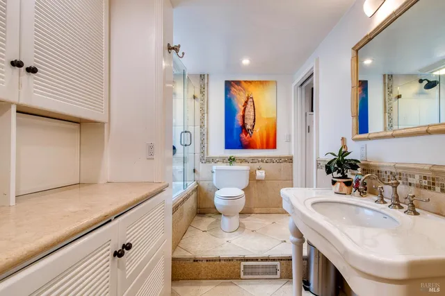 a view of a workspace with furniture and a potted plant