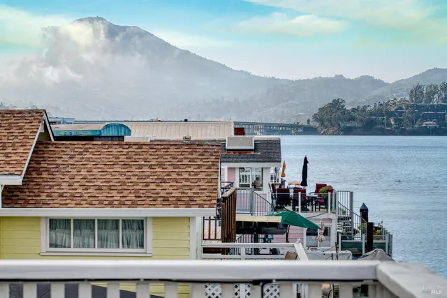 a view of a deck with wooden floor and seating space