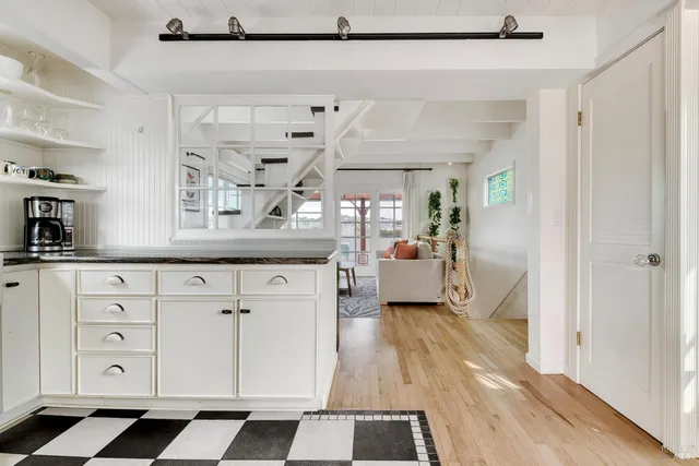 a spacious bathroom with a sink and a mirror