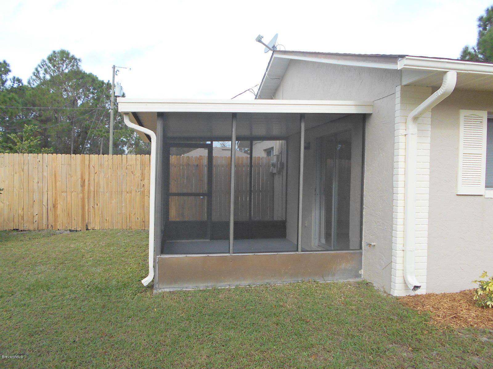 711 Airoso Road Southeast Palm Bay, FL 32909 - Photo 2 of 39 Screened Porch